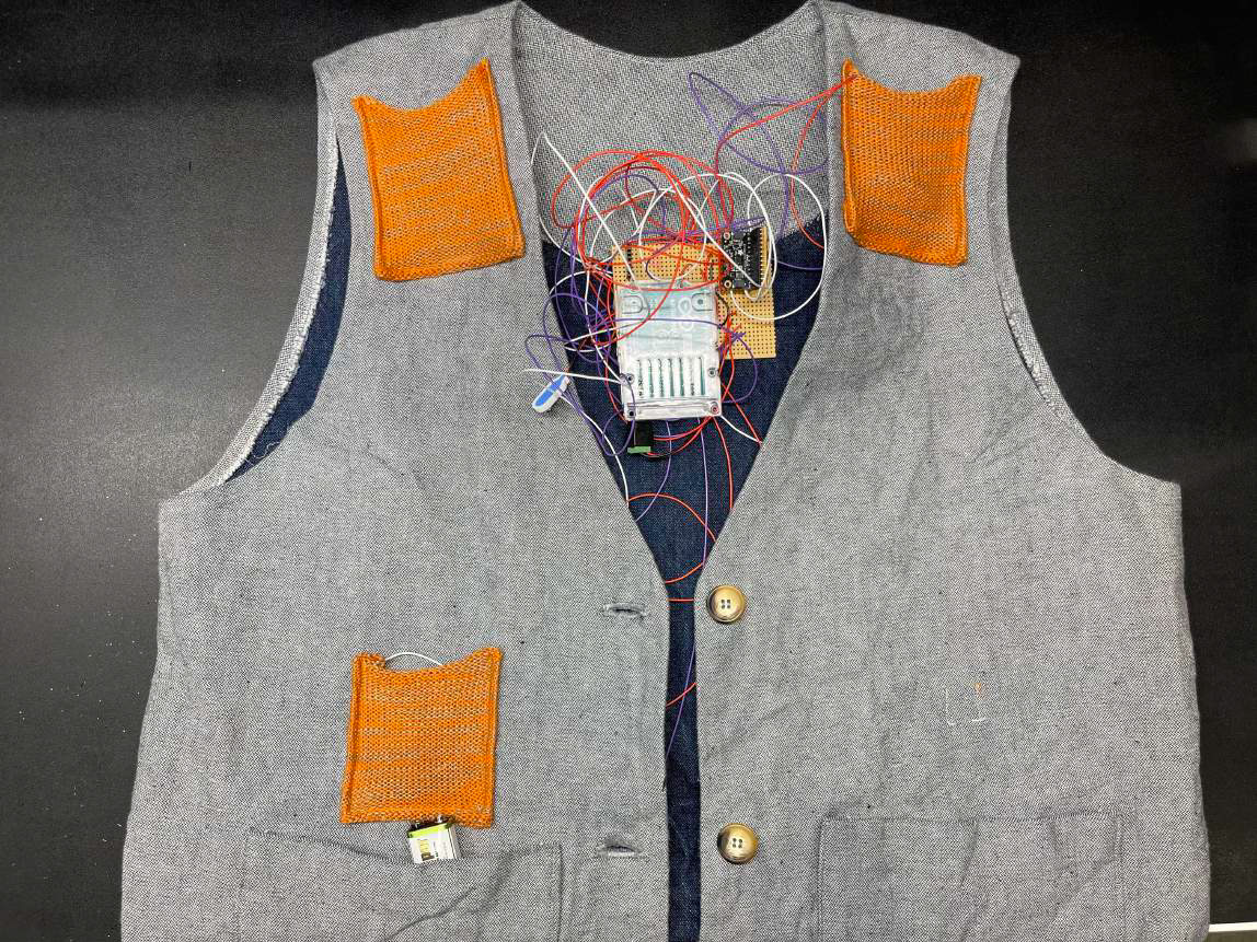 grey vest with arduino microcontroller